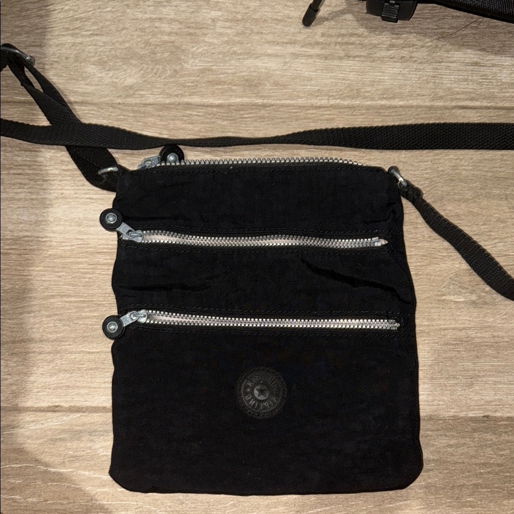Kipling Black Shoulder Bag with Adjustable Strap and Sleek Design